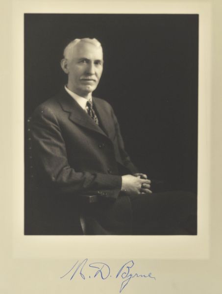 Waist-up seated portrait of M.D. Byrne, Milwaukee company president.