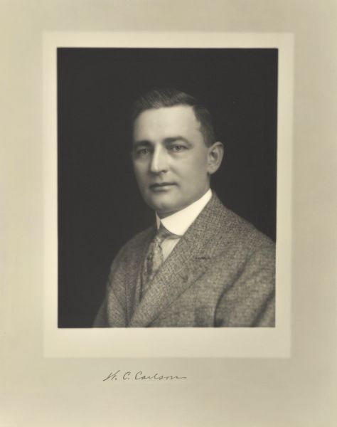 Quarter-length studio portrait of Walter C. Carlson, Milwaukee company president.