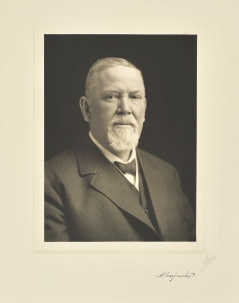 Quarter-length studio portrait of Michael Carpenter, Milwaukee manufacturer.