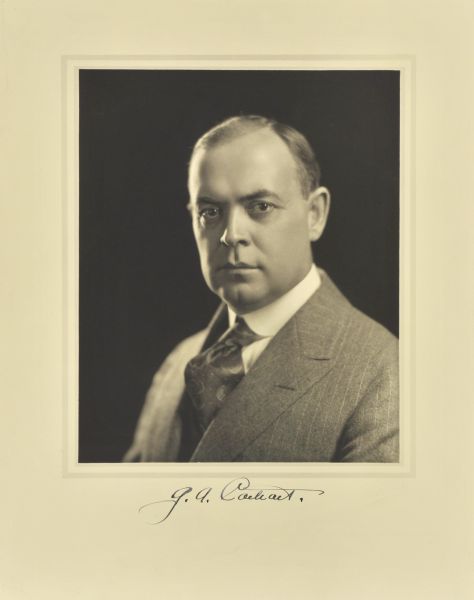 Quarter-length studio portrait of George A. Carhart, Milwaukee physician.