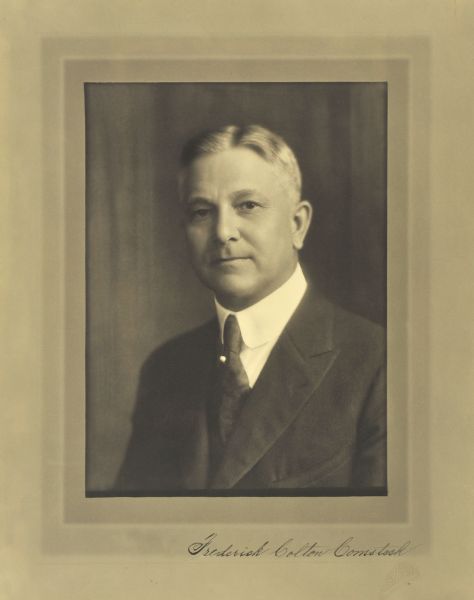 Quarter-length studio portrait of Frederick Colton Comstock, Milwaukee grocer.