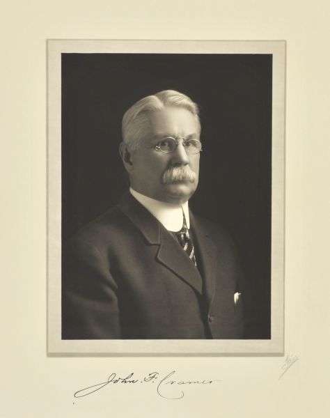 Quarter-length studio portrait of John F. Cramer, Milwaukee publisher.
