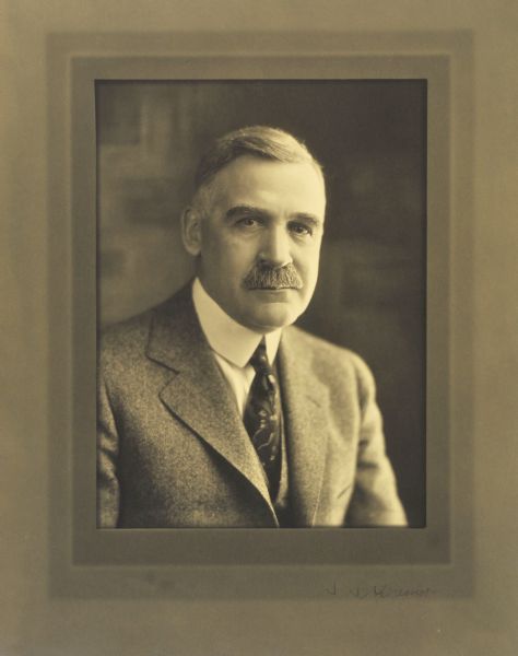 Quarter-length studio portrait of S.S. Cramer, MIlwaukee company president.