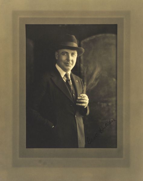 Three-quarter length studio portrait of George C. Dutcher, Milwaukee attorney.