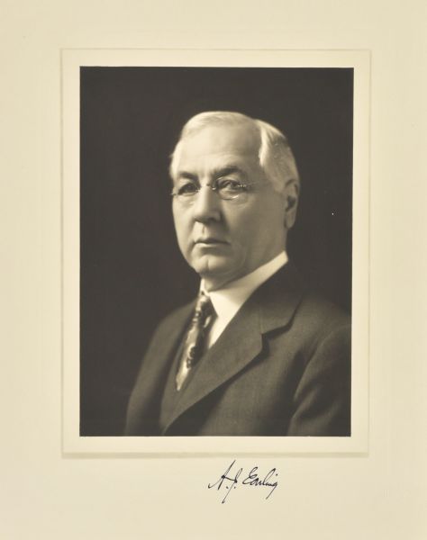 Quarter-length studio portrait of A.J. Earling, Chicago railway president.