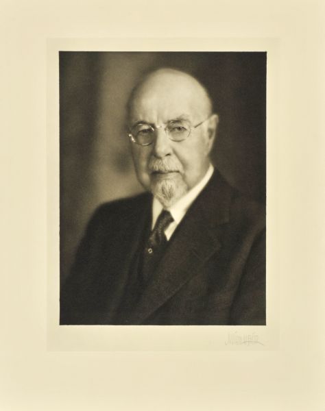 Head and shoulders portrait of John Welton Fisher, Milwaukee medical director.