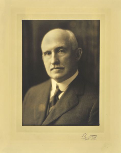 Quarter-length studio portrait of Grant Fitch, Milwaukee banker.