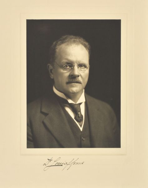 Quarter-length studio portrait of Louis F. Frank, Milwaukee physician.