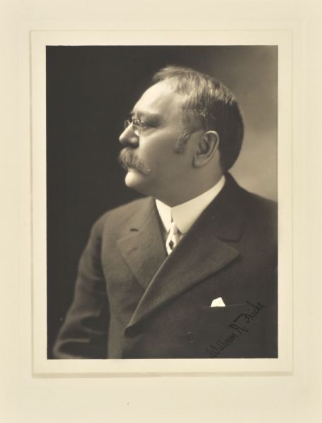 Quarter-length studio profile portrait of William A. Fricke, Milwaukee insurance commissioner.