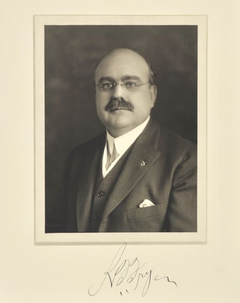 Quarter-length studio portrait of Rupert R. Fry, Milwaukee insurance company president.
