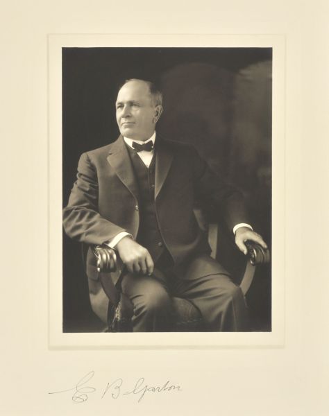 Three-quarter length seated studio portrait of E.B. Garton, Milwaukee manufacturer.