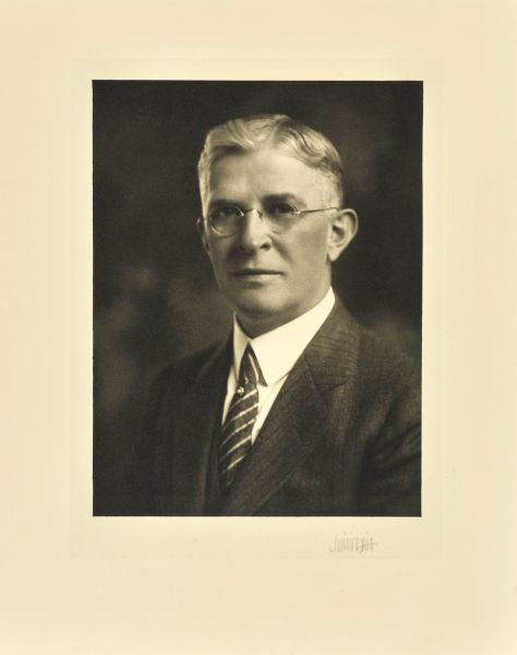 Quarter-length studio portrait of Walter Gerhardy, Milwaukee company president.