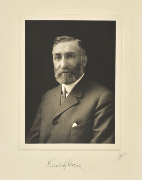Quarter-length studio portrait of Sheldon J. Glass, Milwaukee company vice-president.