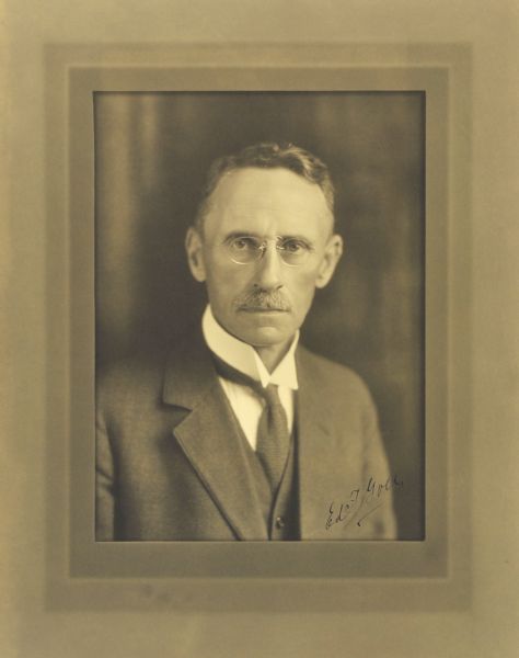 Quarter-length studio portrait of Edward F. Goes, Milwaukee company vice-president.