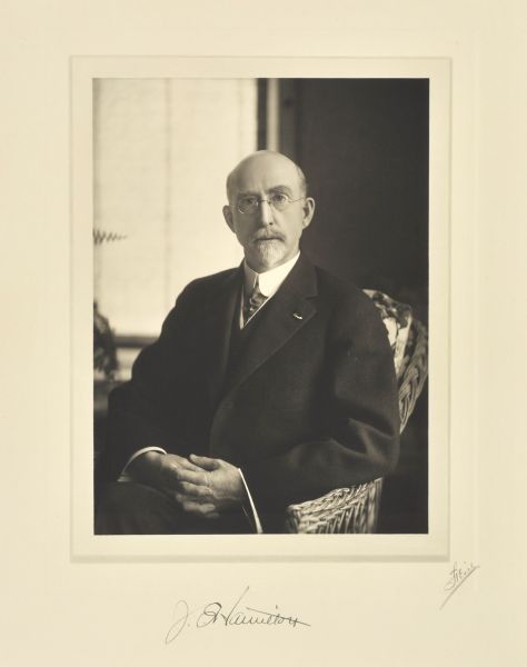 Waist-up seated portrait of J.E. Hamilton, Two Rivers manufacturer.