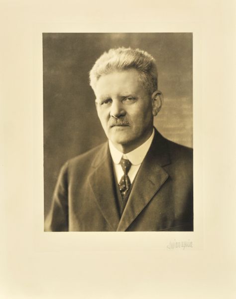 Quarter-length studio portrait of H. Harnischfeger, Milwaukee manufacturer.
