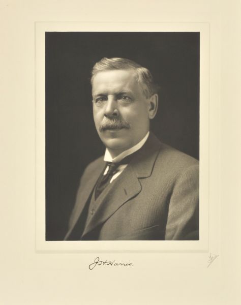 Quarter-length studio portrait of John H. Harris, Elkhorn company president.