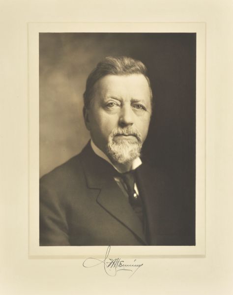 Quarter-length studio portrait of Charles W. Henning, Milwaukee company vice-president.