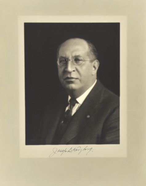Quarter-length studio portrait of Joseph Herzberg, Milwaukee company manager.