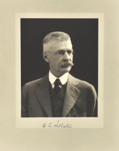 Quarter-length studio portrait of O.L. Hollister, Milwaukee company president.