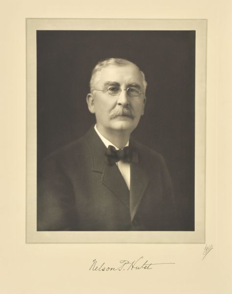 Quarter-length studio portrait of Nelson P. Hulst, Milwaukee engineer.