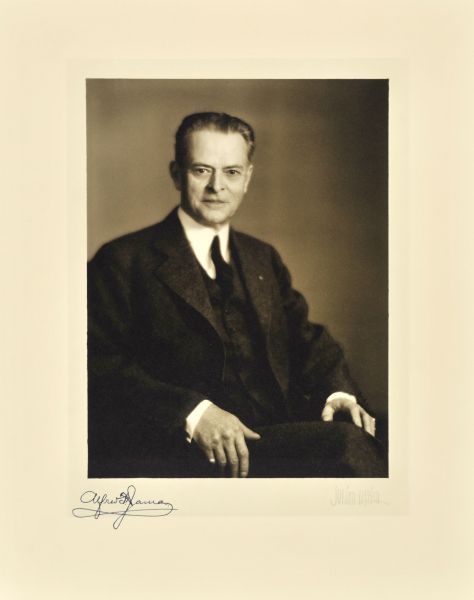 Waist-up seated studio portrait of Alfred F. James, Milwaukee company president.