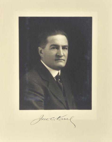 Quarter-length studio portrait of John C. Karel, Milwaukee judge.