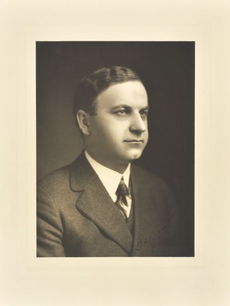 Quarter-length studio portrait of George A. Kissel, Hartford company president.