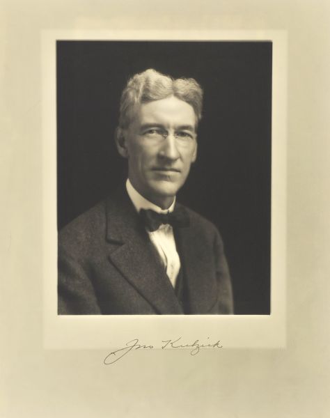 Quarter-length studio portrait of John Kulzick, Milwaukee manufacturer.