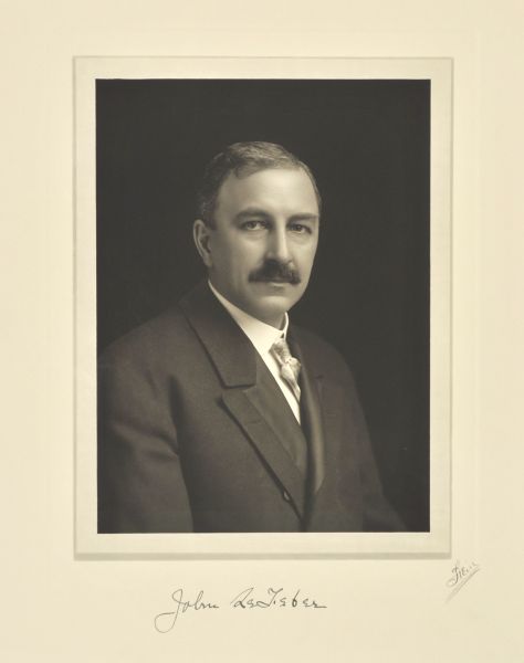 Quarter-length studio portrait of John Lefeber, Milwaukee company president.