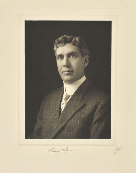 Quarter-length studio portrait of Harry W. Lewis, Milwaukee company president.