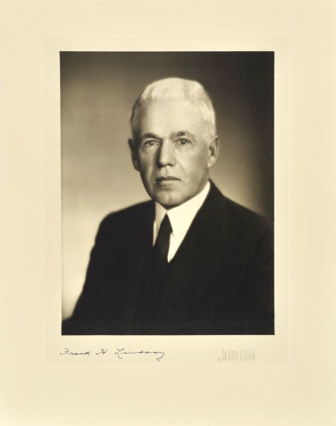 Quarter-length studio portrait of Frank H. Lindsay, Milwaukee company chairman.