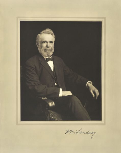 Three-quarter length seated studio portrait of William Lindsay, Milwaukee merchant.
