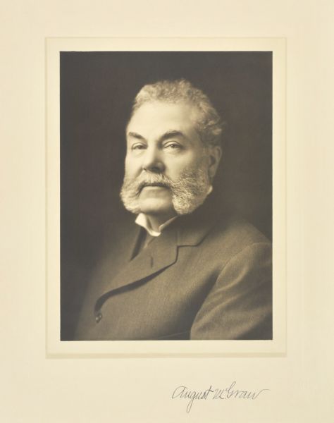 Quarter-length studio portrait of August McGraw, Milwaukee company president.