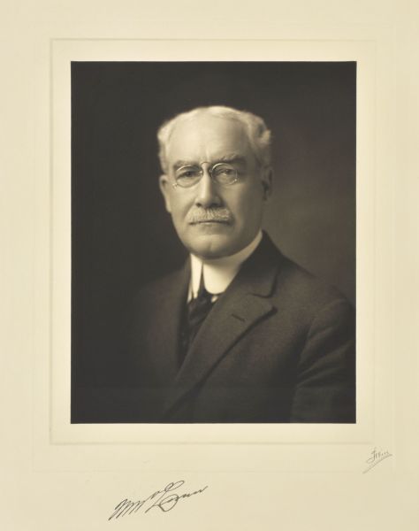 Quarter-length studio portrait of William McLann, Milwaukee merchant.