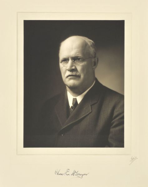 Quarter-length studio portrait of Charles E. McLenegan, Milwaukee librarian.