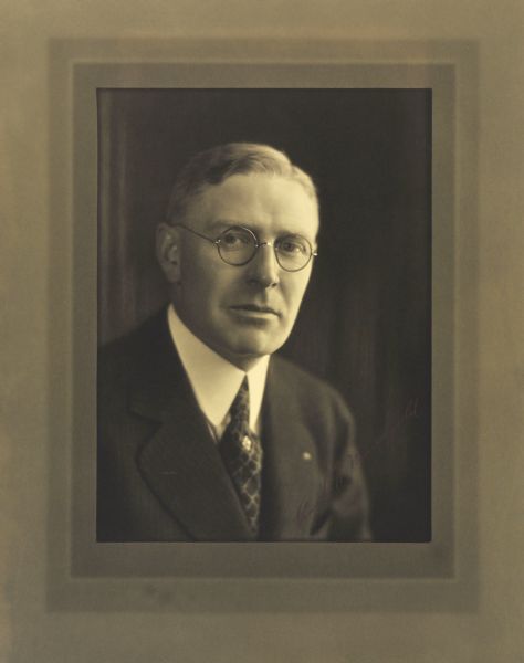 Quarter-length studio portrait of Frank W. Manegold, Milwaukee company secretary and treasurer.