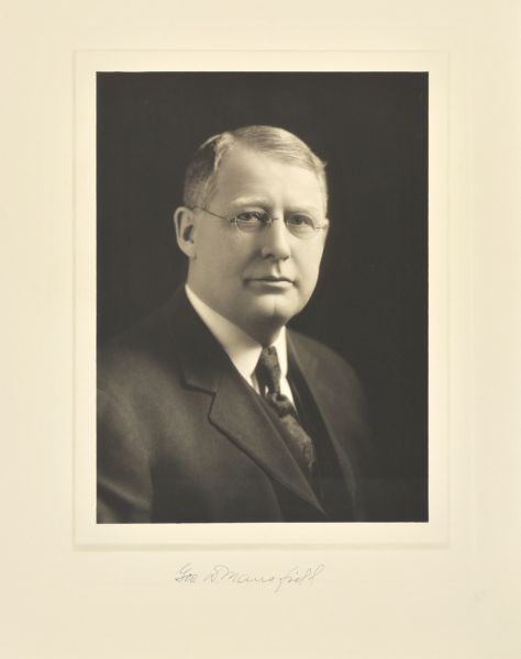 Quarter-length studio portrait of George D. Mansfield, Milwaukee company president.