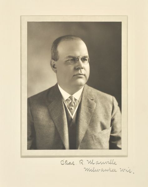 Quarter-length studio portrait of Charles R. Manville, Milwaukee company vice-president.