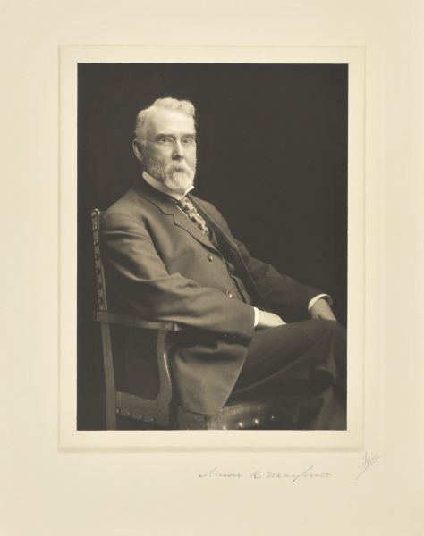 Three-quarter length seated studio portrait of Anson K. Mayhew, Milwaukee lumberman and manufacturer.