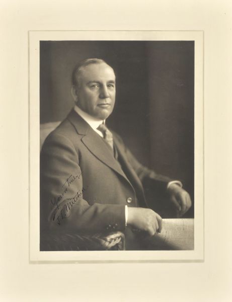 Waist-up seated studio portrait of F.L. Mitchell.