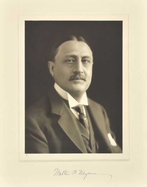 Quarter-length studio portrait of Walter F. Myers, Milwaukee banker.