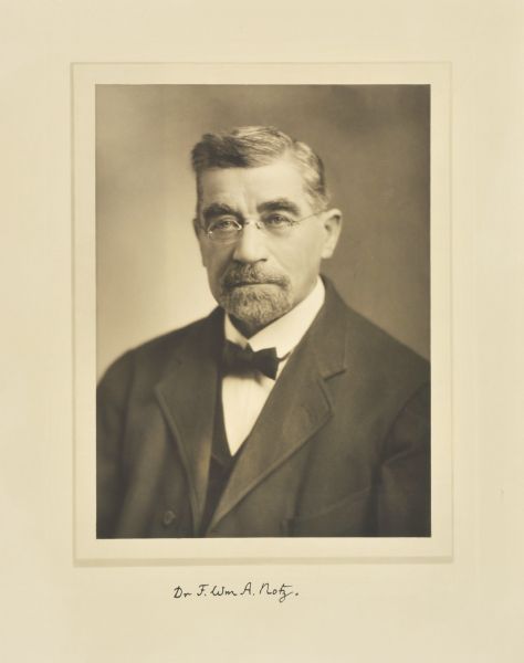 Quarter-length studio portrait of F. William A. Notz, Milwaukee doctor and member of the Board of Regents of the University of Wisconsin.