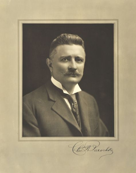 Quarter-length studio portrait of Charles A. Paeschke, Milwaukee manufacturer.