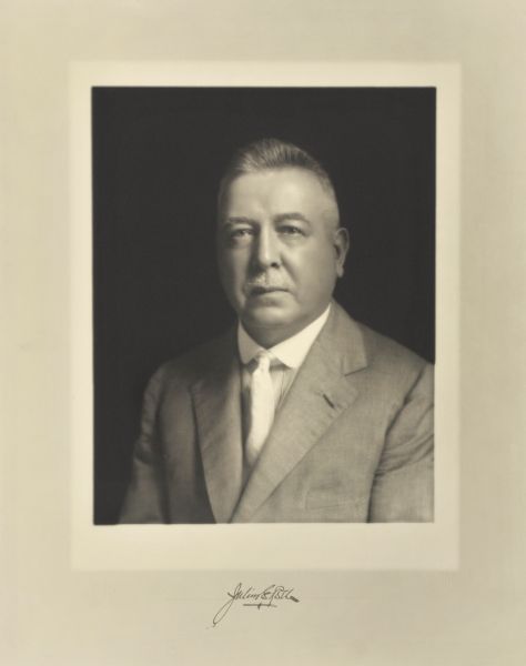 Quarter-length studio portrait of Julius E. Roehr, Milwaukee attorney.
