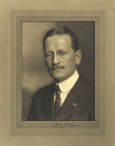 Quarter-length studio portrait of Philip F. Rogers, Milwaukee surgeon.