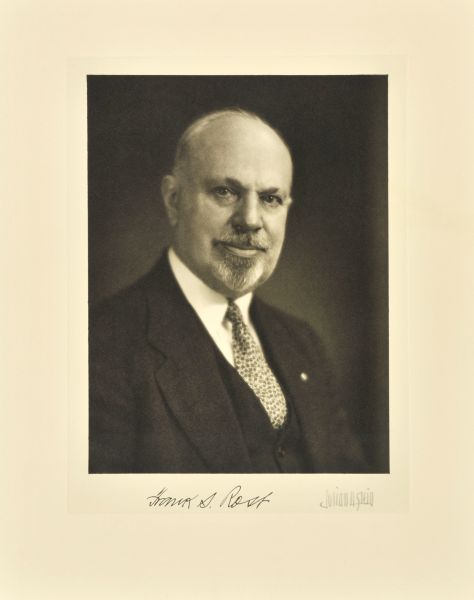 Quarter-length studio portrait of Frank S. Rost, Milwaukee company vice-president.