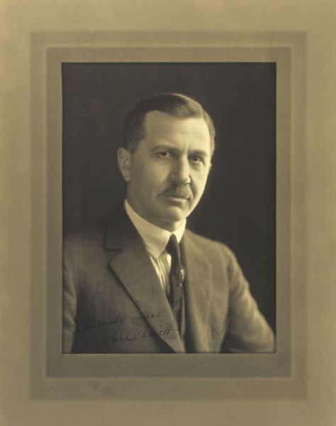Quarter-length studio portrait of Chriesant M. Schmitt, Milwaukee manufacturer.