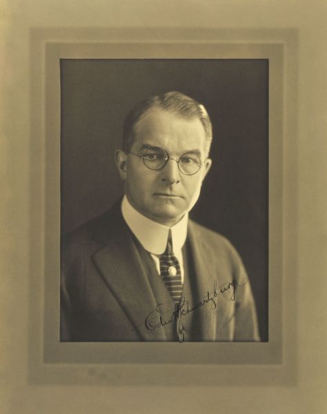 Quarter-length studio portrait of Edward H. Schwartzburg, Milwaukee company secretary.