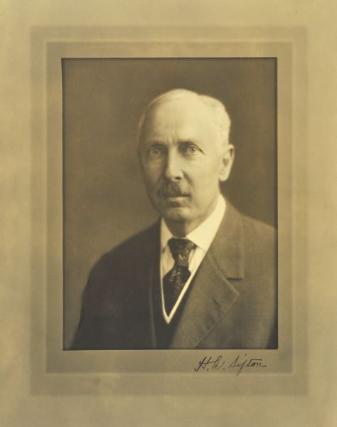 Quarter-length studio portrait of H. W. Sifton, Milwaukee physician.